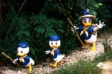 Three Duck Characters Hiking